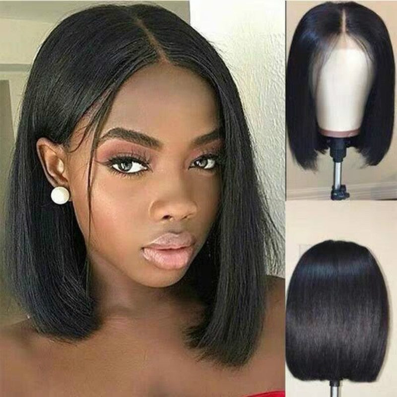 Short bob wig in heat resistant synthetic fibre, natural black colour, chin-length silhouette shown on a model
